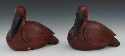 Appraisal: A Pair of Very Decorative Ceramic Pelicans The large seated