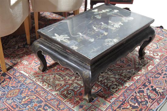 Appraisal: ORIENTAL STYLE LOW TABLE Black lacquered table with embossed Oriental