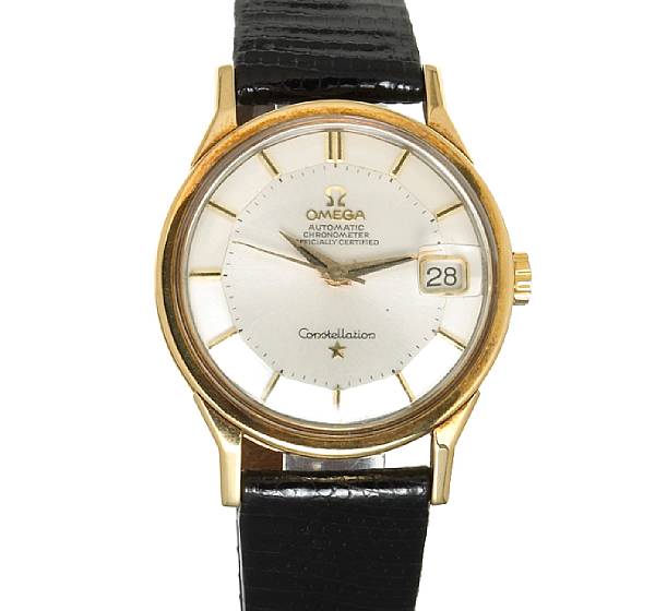 Appraisal: An eighteen karat gold and leather wristwatch Omega Constellation Automatic