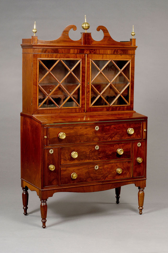 Appraisal: MASSACHUSETTS SHERATON MAHOGANY SECRETARY BOOKCASE The swan's neck crest centering