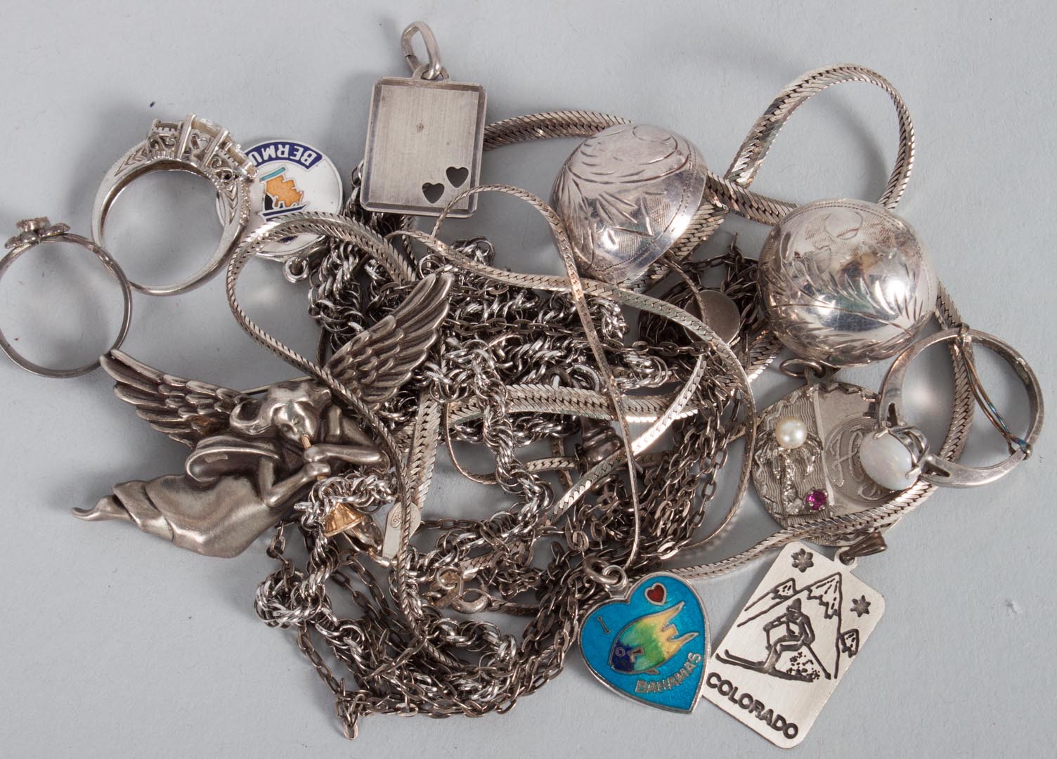 Appraisal: Fourteen assorted sterling silver jewelry items including necklaces rings charms