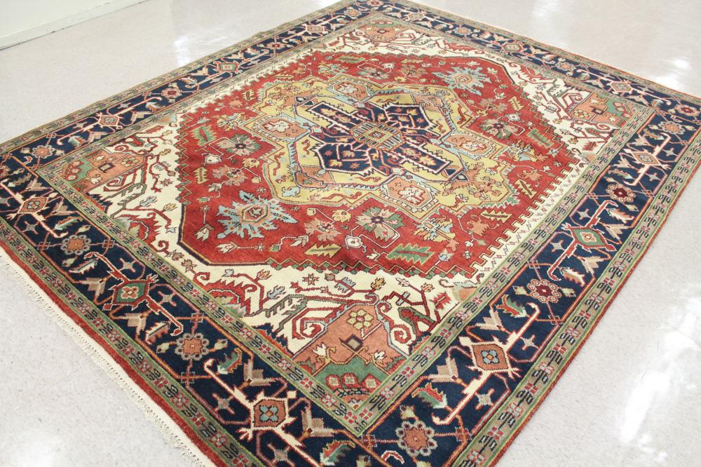 Appraisal: HAND KNOTTED ORIENTAL CARPET Persian Serapi or Heriz design centering