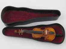 Appraisal: A miniature violoncello length cm in moulded case