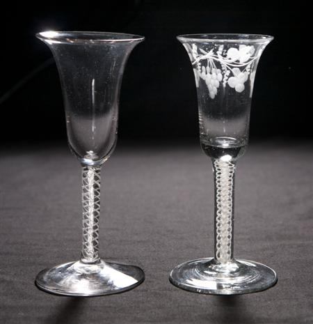 Appraisal: Two air twist wine glasses th century each with trumpet