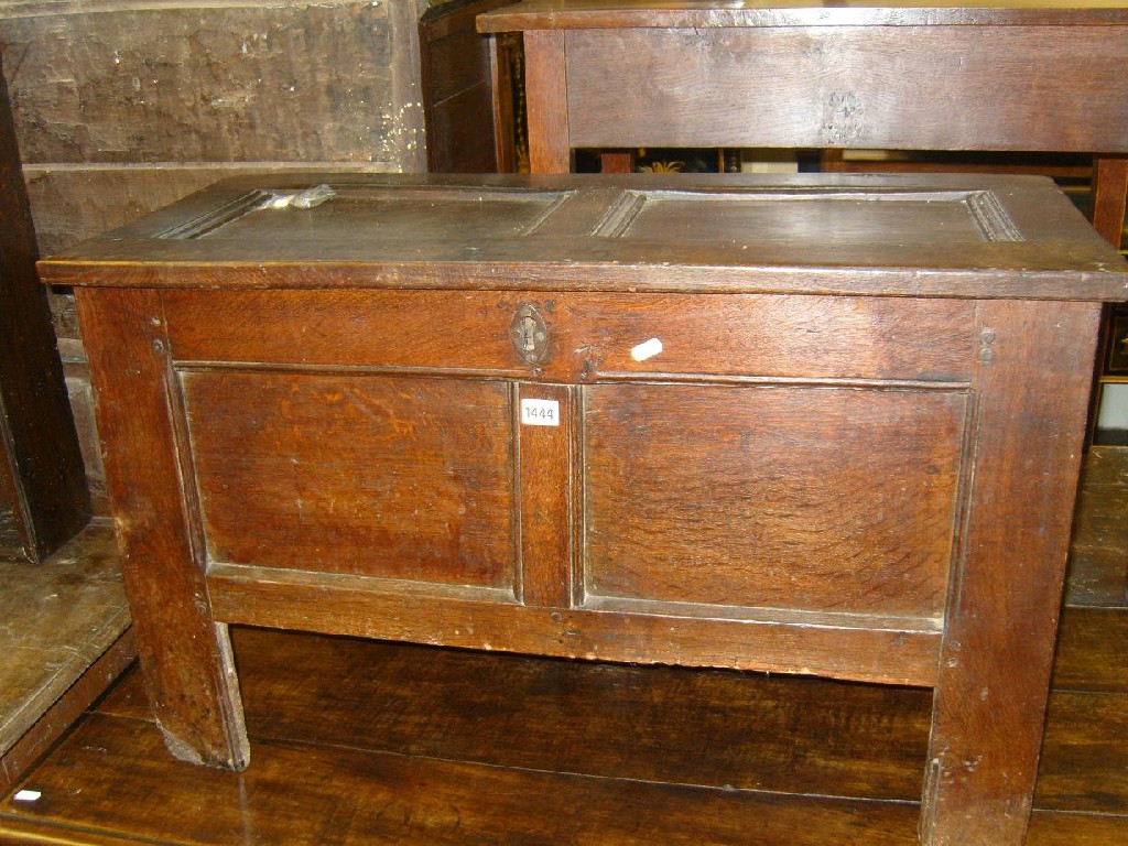 Appraisal: A small Georgian oak coffer with panelled frame and square