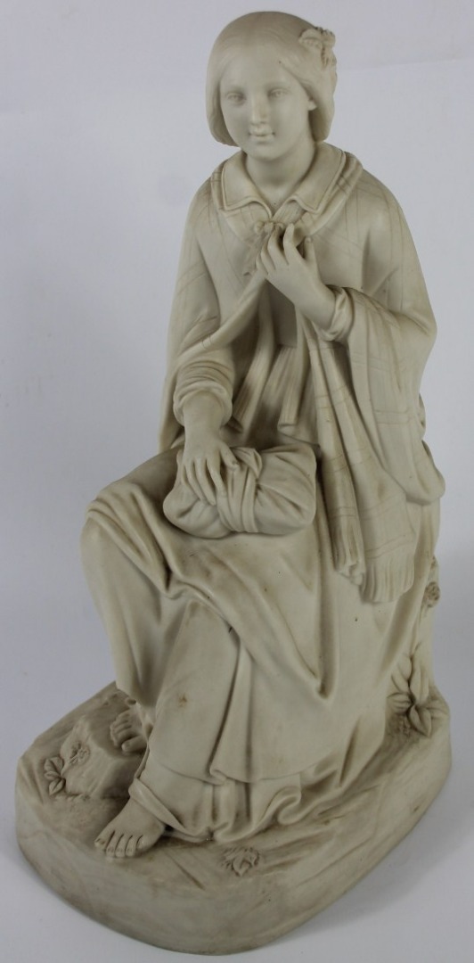 Appraisal: A Victorian parian figure modelled as a seated peasant woman