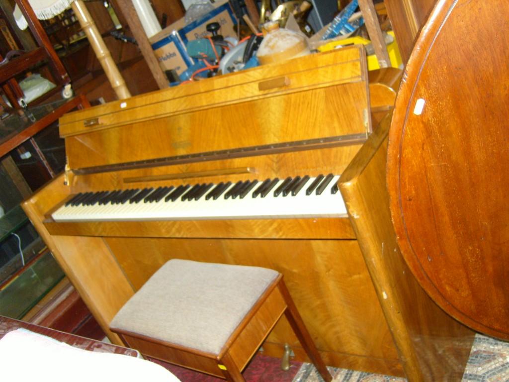 Appraisal: The Eavestaff Pianette mini piano iron framed within a polished