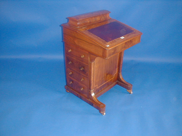 Appraisal: A Victorian figured walnut Davenport with domed and raised letter