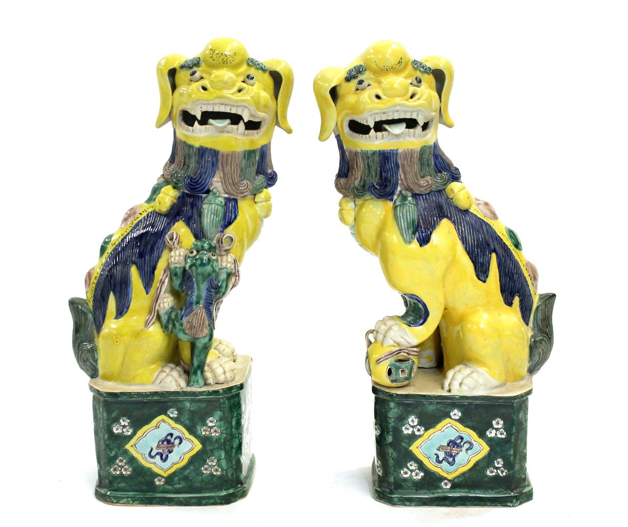 Appraisal: A pair of th century Chinese Buddhist lions coloured in