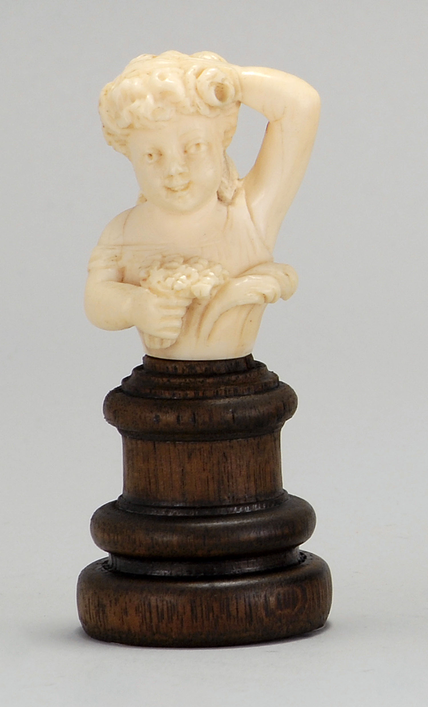 Appraisal: CARVED IVORY BUST Circa Depicting a young girl with a