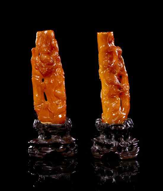 Appraisal: A Pair of Amber Handles each in the form of