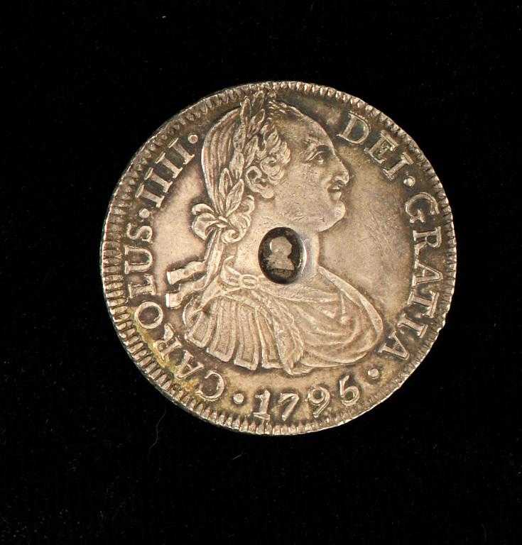 Appraisal: GEORGE III OVAL COUNTERMARKED PILLAR TYPE DOLLAR MEXICO CITY MINT