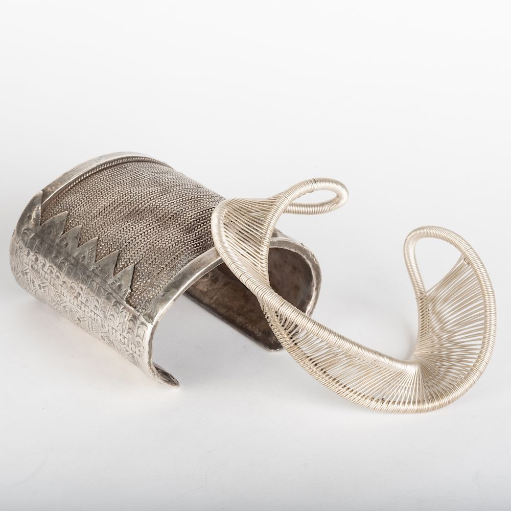 Appraisal: Two Contemporary Silver Cuff Bracelets Together with a silvered metal