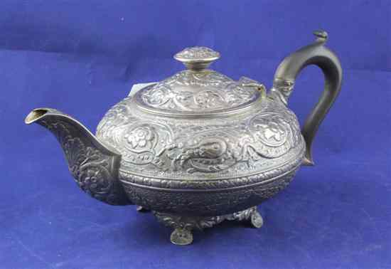 Appraisal: A George III embossed silver teapot of squat circular form