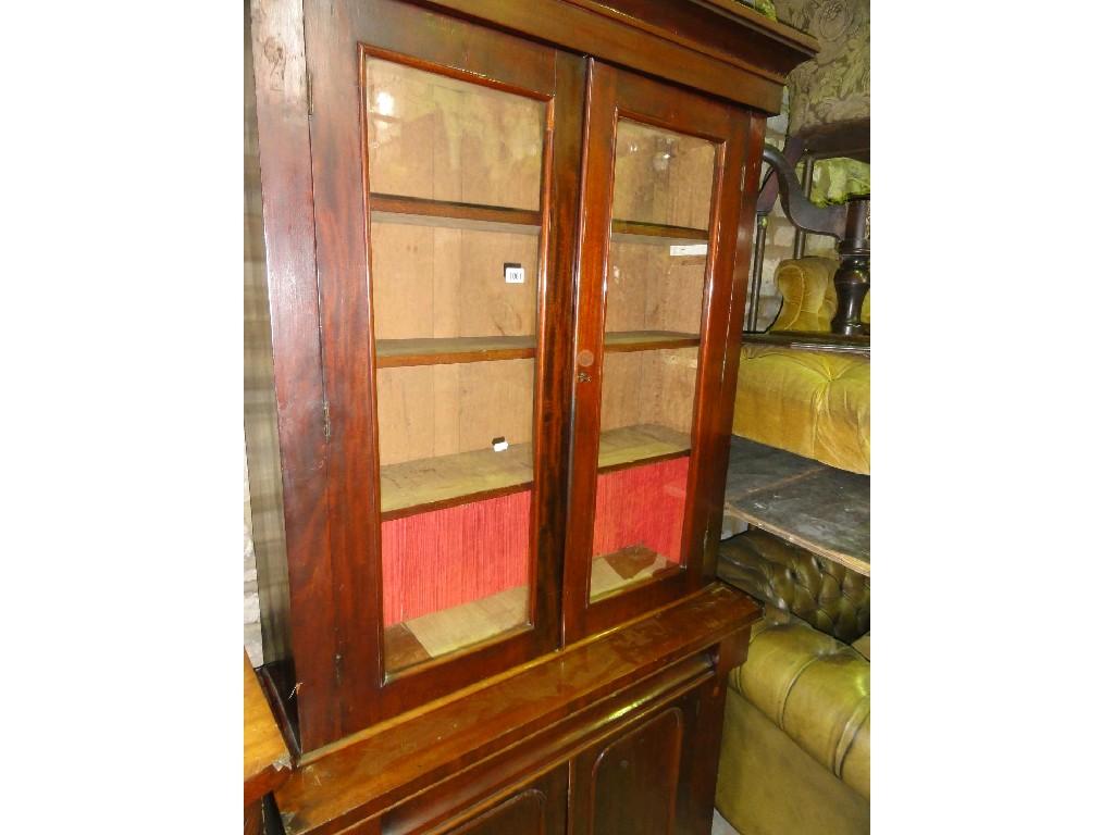 Appraisal: A Victorian mahogany library bookcase the upper section enclosed by