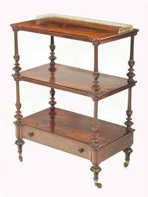 Appraisal: An early Victorian rosewood three tier whatnot with brass gallery