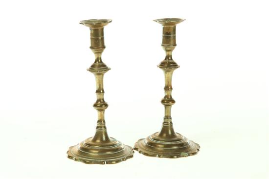 Appraisal: PAIR OF BRASS CANDLESTICKS England th century Scalloped bases and