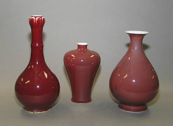 Appraisal: Three flamb glazed porcelain vases th Century Comprised of one