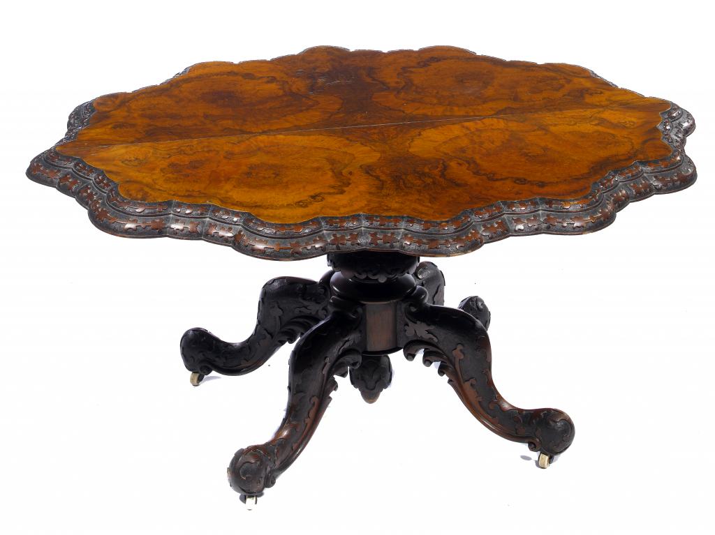 Appraisal: A VICTORIAN WALNUT LOO TABLE the richly figured quarter veneered