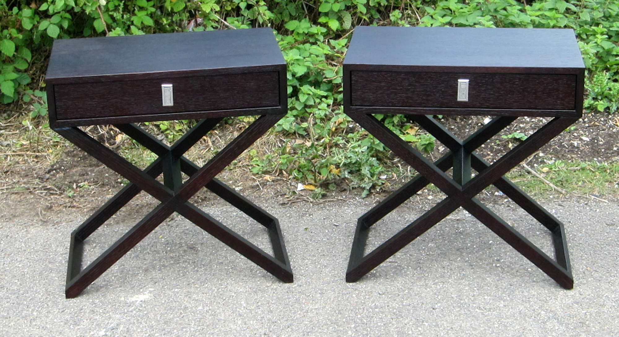 Appraisal: Pair of stained oak single drawer side tables on 'x'