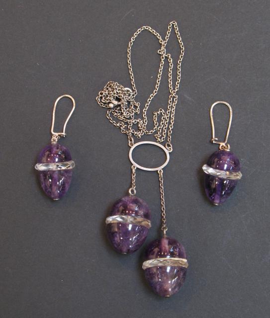 Appraisal: A 'S STYLE SILVER CHAIN with amethyst egg-shaped pendants and