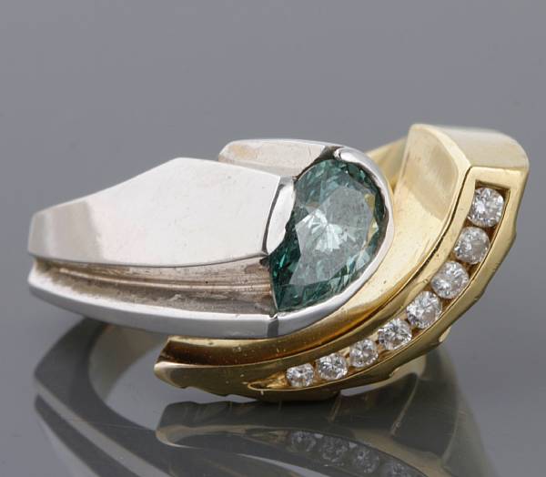 Appraisal: A treated blue diamond and k bi-color gold ring central