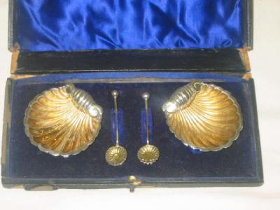 Appraisal: A PAIR OF VICTORIAN SALTS modelled as fluted shells on