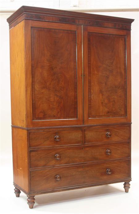 Appraisal: A th century mahogany linen press the projected moulded cornice