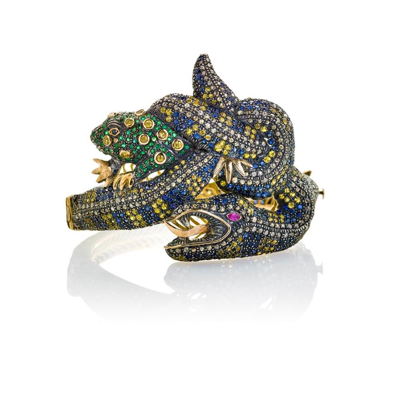 Appraisal: MULTI GEM FIGURAL SERPENT AND FROG BRACELET Designed as a