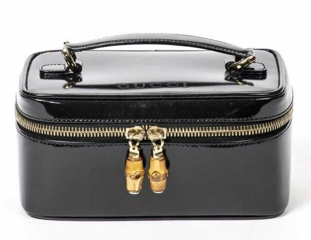 Appraisal: Gucci black patent leather mini cosmetic pouch top handle with