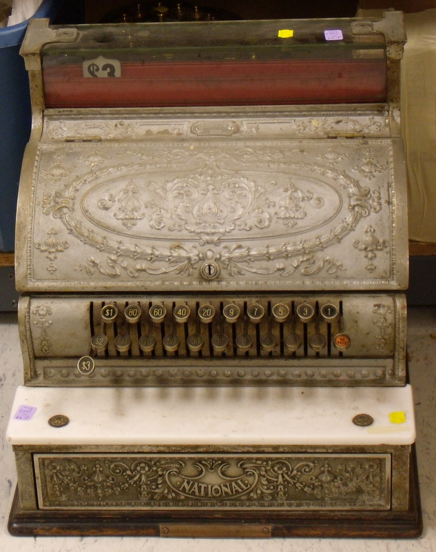 Appraisal: National Cash Register nickeled brass case with raised decoration keys