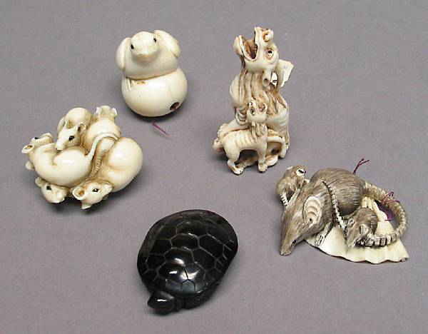 Appraisal: Four ivory animal netsuke Including a kirin and young a