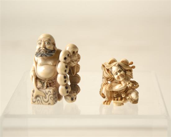 Appraisal: Two Elephant Ivory Carved Netsuke one of a bearded man