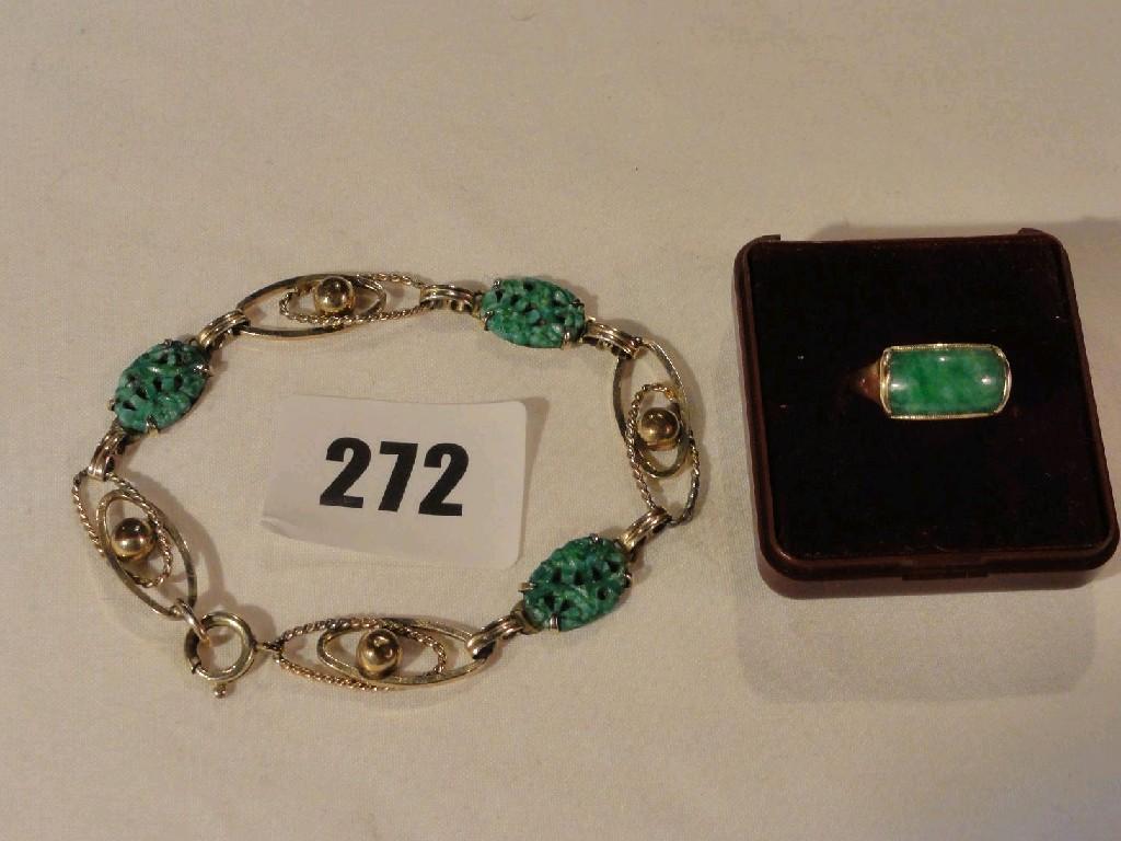 Appraisal: An k gold ring with stylised jade setting together with