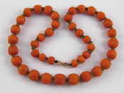 Appraisal: A graduated carved coral bead necklace approx cm long beads