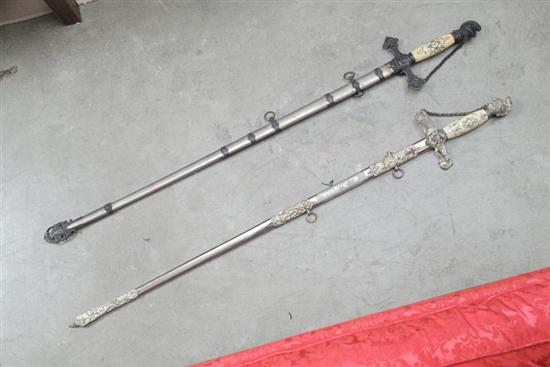 Appraisal: TWO FRATERNAL SWORDS Including one sword with an etched blade