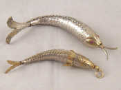 Appraisal: Two finely articulated white metal fish pendants and cm long