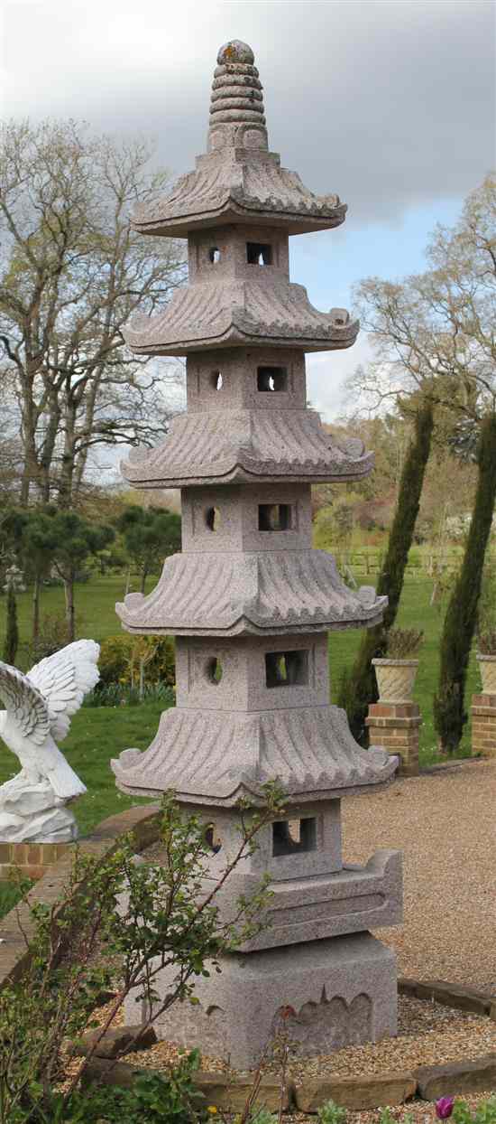 Appraisal: A carved pink granite six tier pagoda with fittings for