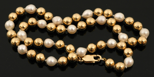 Appraisal: STRAND OF CULTURED PEARLS AND CT GOLD HOLLOW BEADS