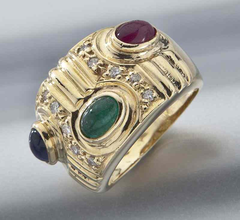 Appraisal: K gold diamond ruby emerald and sapphire ringfeaturing one oval