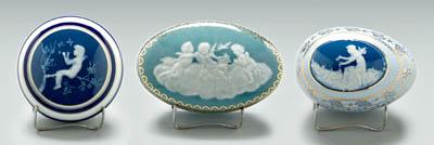 Appraisal: Three lidded pate-sur-pate boxes one lid with cupids in clouds