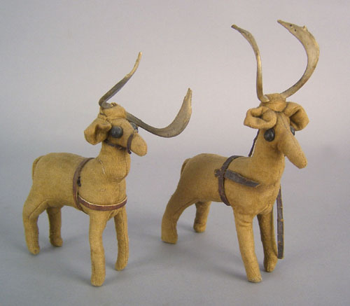 Appraisal: Pair of cloth stuffed reindeer with leather harness button eyes