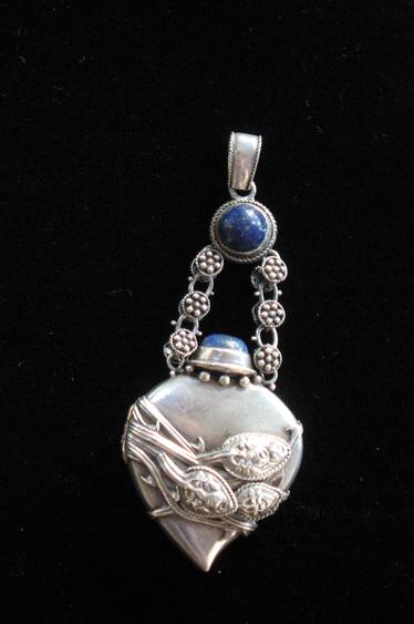 Appraisal: A WHITE METAL LADY'S CHATELAINE LOCKET in the form of