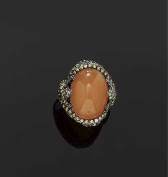 Appraisal: MOONSTONE AND DIAMOND RING White gold Fancy model set with