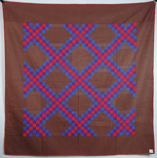 Appraisal: PIECED AMISH QUILT Triple Irish chain in colors of brown