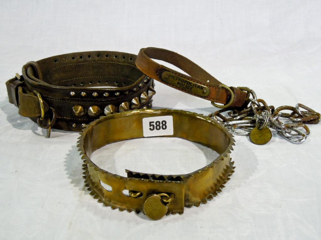 Appraisal: A dog's brass protective hunting collar with double serrated edge