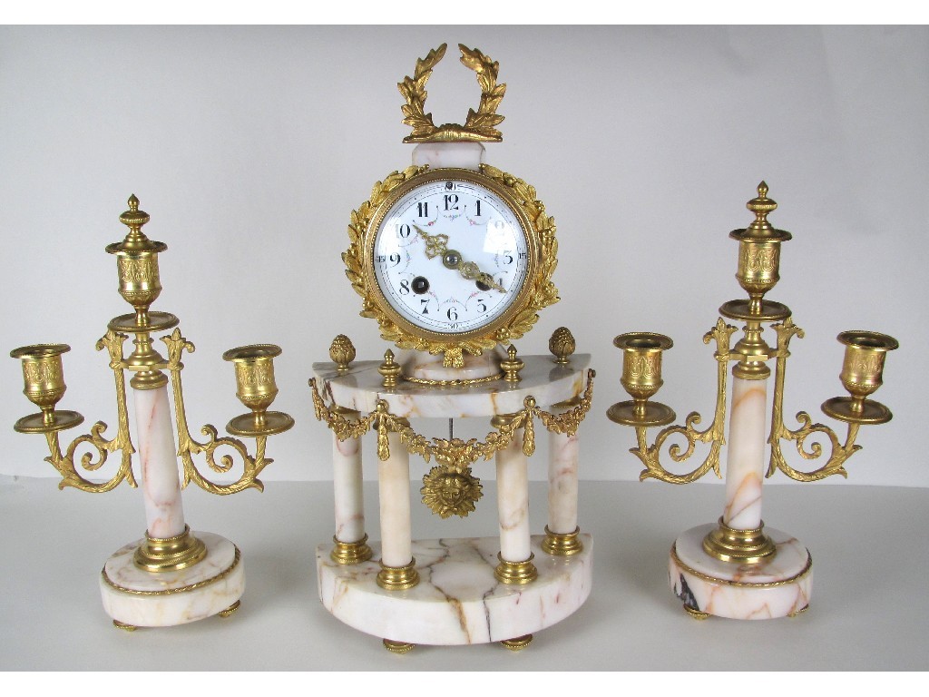 Appraisal: A French gilt metal and marble clock garniture the drum