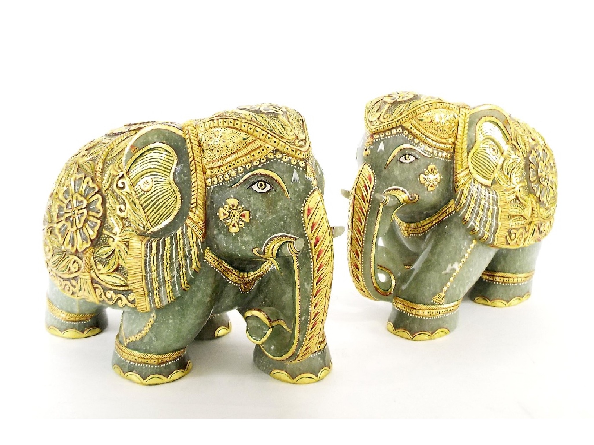 Appraisal: Large pair of carved jade elephants with elaborate gilt decoration