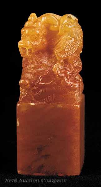 Appraisal: A Chinese Carved and Incised Red Dragon Seal Qing Dynasty