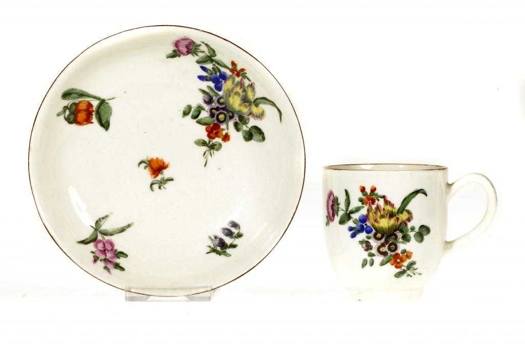 Appraisal: A WORCESTER COFFEE CUP AND SAUCER painted in bright enamels